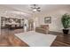 Living room with hardwood floors, a view into kitchen, and plush seating at 2717 W Nighthawk Way, Phoenix, AZ 85045