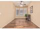 Home office with hardwood floors, plantation shutters, and built in shelving at 2717 W Nighthawk Way, Phoenix, AZ 85045