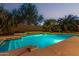 Relaxing pool with water feature and surrounding landscaping at 2717 W Nighthawk Way, Phoenix, AZ 85045