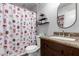 Clean bathroom with a shower/tub combo and granite vanity at 3433 W Poinsettia Dr, Phoenix, AZ 85029