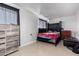 Small bedroom with a double bed and dresser at 3433 W Poinsettia Dr, Phoenix, AZ 85029
