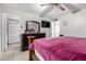 Main bedroom with a king-size bed and ensuite bathroom at 3433 W Poinsettia Dr, Phoenix, AZ 85029