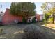 Brick home with a large backyard and mature trees at 3433 W Poinsettia Dr, Phoenix, AZ 85029