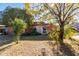Brick home with a landscaped yard and circular driveway at 3433 W Poinsettia Dr, Phoenix, AZ 85029