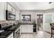 Kitchen with white cabinets and stainless steel appliances at 3433 W Poinsettia Dr, Phoenix, AZ 85029