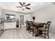 Kitchen with white cabinets, stainless steel appliances, and breakfast bar at 3433 W Poinsettia Dr, Phoenix, AZ 85029