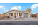 Charming single story home with gray garage door and landscaped yard at 550 W Ramos Dr, Casa Grande, AZ 85122