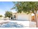 One-story home with attached garage and well-maintained yard at 34831 N Mashona Trl, San Tan Valley, AZ 85143