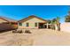 Landscaped backyard with a patio and fire pit at 34831 N Mashona Trl, San Tan Valley, AZ 85143
