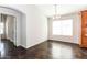Bright dining area with large window and dark stained concrete floors at 34831 N Mashona Trl, San Tan Valley, AZ 85143