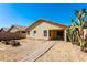 Backyard view of home with a patio and desert plants at 34831 N Mashona Trl, San Tan Valley, AZ 85143