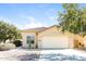 Single-story home with attached garage and desert landscaping at 34831 N Mashona Trl, San Tan Valley, AZ 85143
