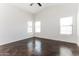 Spacious bedroom with multiple windows and dark stained concrete floors at 34831 N Mashona Trl, San Tan Valley, AZ 85143