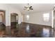 Spacious living area with high ceilings, recessed lighting, and dark stained concrete floors at 34831 N Mashona Trl, San Tan Valley, AZ 85143