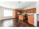 Modern kitchen with wood cabinets, stainless steel appliances, and island at 34831 N Mashona Trl, San Tan Valley, AZ 85143