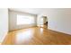 Bright living room with hardwood floors and an arched entryway at 4903 W Desert Cove Ave, Glendale, AZ 85304