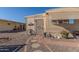 Landscaped front yard with stone pathway and rustic decor at 2650 W Union Hills Dr # 184, Phoenix, AZ 85027