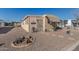 Tan colored manufactured home with stone pathway and landscaping at 2650 W Union Hills Dr # 184, Phoenix, AZ 85027