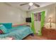 Bedroom with teal bedding and ceiling fan at 2650 W Union Hills Dr # 184, Phoenix, AZ 85027