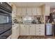 Kitchen with white cabinets and stainless steel appliances at 2650 W Union Hills Dr # 184, Phoenix, AZ 85027