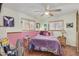 Cozy bedroom with purple bedding and ceiling fan at 2650 W Union Hills Dr # 184, Phoenix, AZ 85027
