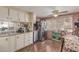 Galley kitchen with stainless steel appliances and wood floors at 2650 W Union Hills Dr # 184, Phoenix, AZ 85027