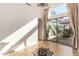 Sunlit living room showcasing hardwood floors and access to a private patio at 915 W Orchard Ln, Litchfield Park, AZ 85340