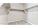 Walk-in closet with double hanging rods and shelving at 5823 E Rose Garden Ln, Phoenix, AZ 85054