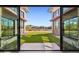 View of backyard through sliding glass doors at 5827 E Rose Garden Ln, Phoenix, AZ 85054