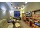 Relaxing media room featuring comfortable seating and built-in shelving at 8854 E Lost Gold Cir, Gold Canyon, AZ 85118