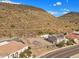 Aerial view of a vacant lot with mountain views and neighboring homes at 5516 W Melinda Ln, Glendale, AZ 85308