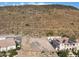 Aerial view of a vacant lot with mountain views and neighboring homes at 5516 W Melinda Ln, Glendale, AZ 85308
