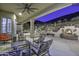 Covered patio with seating area, fireplace, and mountain views at 5516 W Melinda Ln, Glendale, AZ 85308