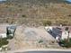 Aerial view of vacant lot, nestled between homes, offering mountain views at 5516 W Melinda Ln, Glendale, AZ 85308