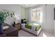 Cozy bedroom with twin bed, and green and gray decor at 18191 W Cielo Grande Ave, Surprise, AZ 85387