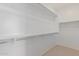 Large walk-in closet with double hanging rods and shelves at 18191 W Cielo Grande Ave, Surprise, AZ 85387