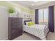 Charming bedroom with full bed and polka dot bedding at 18191 W Cielo Grande Ave, Surprise, AZ 85387