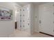 Bright hallway with access to bathroom and bedroom at 18191 W Cielo Grande Ave, Surprise, AZ 85387