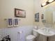 Guest bathroom with subway tile and pedestal sink at 19803 N Desert Song Ct, Surprise, AZ 85374