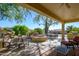 Spacious patio with seating, fire pit and grill at 19803 N Desert Song Ct, Surprise, AZ 85374