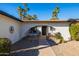 Inviting front entryway with arched doorway and decorative iron gate at 7038 N Via De Los Ninos --, Scottsdale, AZ 85258