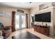 Bright living room featuring a large TV, comfy seating, and access to a patio at 8500 E Southern Ave # 575, Mesa, AZ 85209