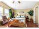 Cozy bedroom with a wooden bed frame, ample natural light, and wood flooring at 8500 E Southern Ave # 575, Mesa, AZ 85209