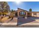 Single-wide manufactured home with covered carport and well-maintained landscaping at 8500 E Southern Ave # 575, Mesa, AZ 85209