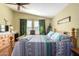 Spacious bedroom with a wooden bed frame and lots of natural light at 8500 E Southern Ave # 575, Mesa, AZ 85209