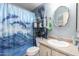 Clean bathroom with updated vanity and dolphin-themed shower curtain at 8500 E Southern Ave # 575, Mesa, AZ 85209