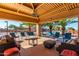 Relaxing community patio with shaded seating and views of the pool at 8500 E Southern Ave # 575, Mesa, AZ 85209