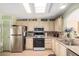 Modern kitchen featuring stainless steel appliances and updated countertops at 8500 E Southern Ave # 575, Mesa, AZ 85209
