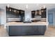 Modern kitchen with large island and dark cabinetry at 300 W Quartz Rock Rd, Phoenix, AZ 85085
