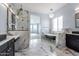 Spa-like bathroom featuring a soaking tub, walk-in shower, and marble accents at 300 W Quartz Rock Rd, Phoenix, AZ 85085